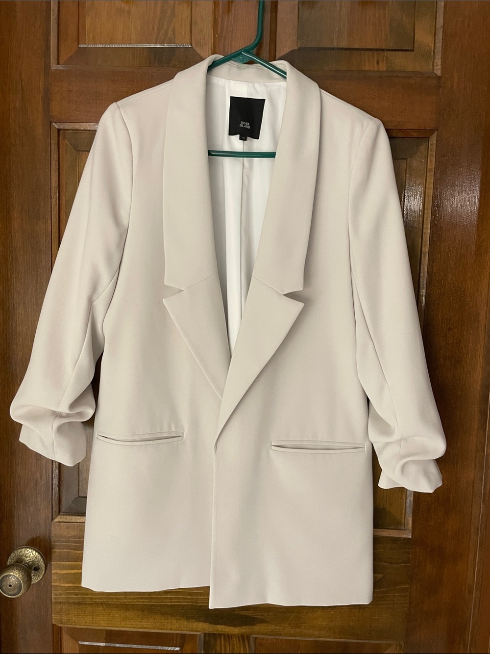 River Island bone-colored lined blazer, front pockets, ruched sleeves, size 12